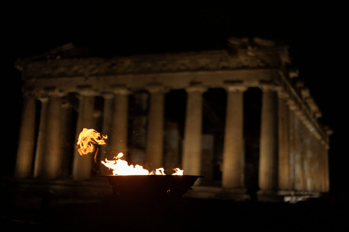 Olympics - 2026 Milano-Cortina Winter Olympics - 2026 Milano-Cortina Winter Olympics Flame Torch Relay - Athens, Greece - December 3, 2025 A cauldron with the Olympic Flame atop Acropolis Hill as the Parthenon temple is seen in the background. REUTERS